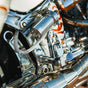 OG HoneyComp V3 Foot Pegs installed on a 2024 Softail Low Rider ST FXLRST