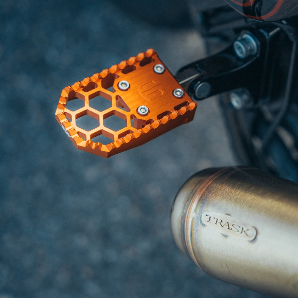 OG HoneyComp V3 Foot Pegs installed on a 2024 Road Glide FLTR